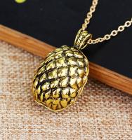 Golden necklace with a dragon scaled egg pendant, vintage steampunk fantasy